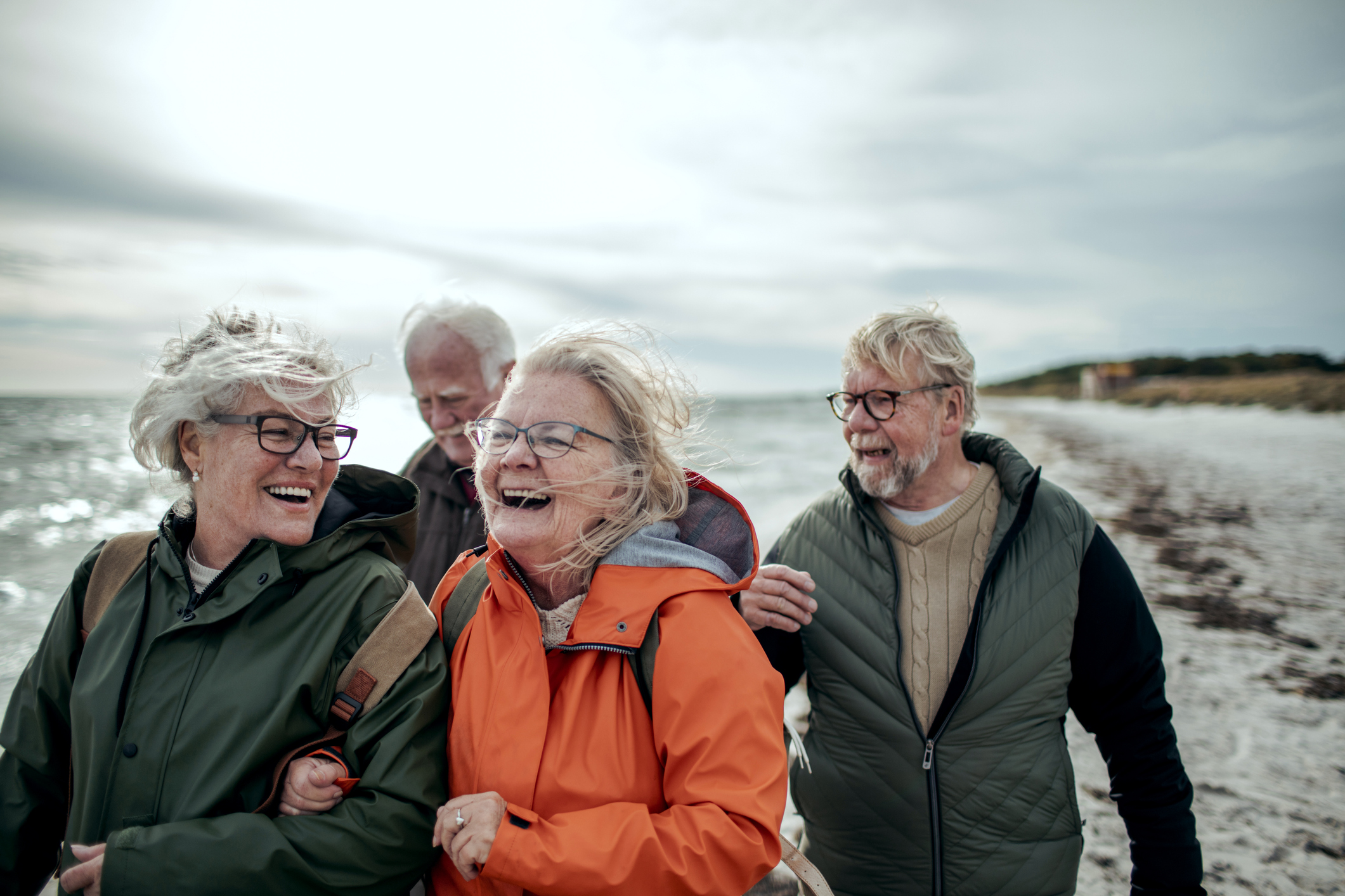 Seniors walking on the beach