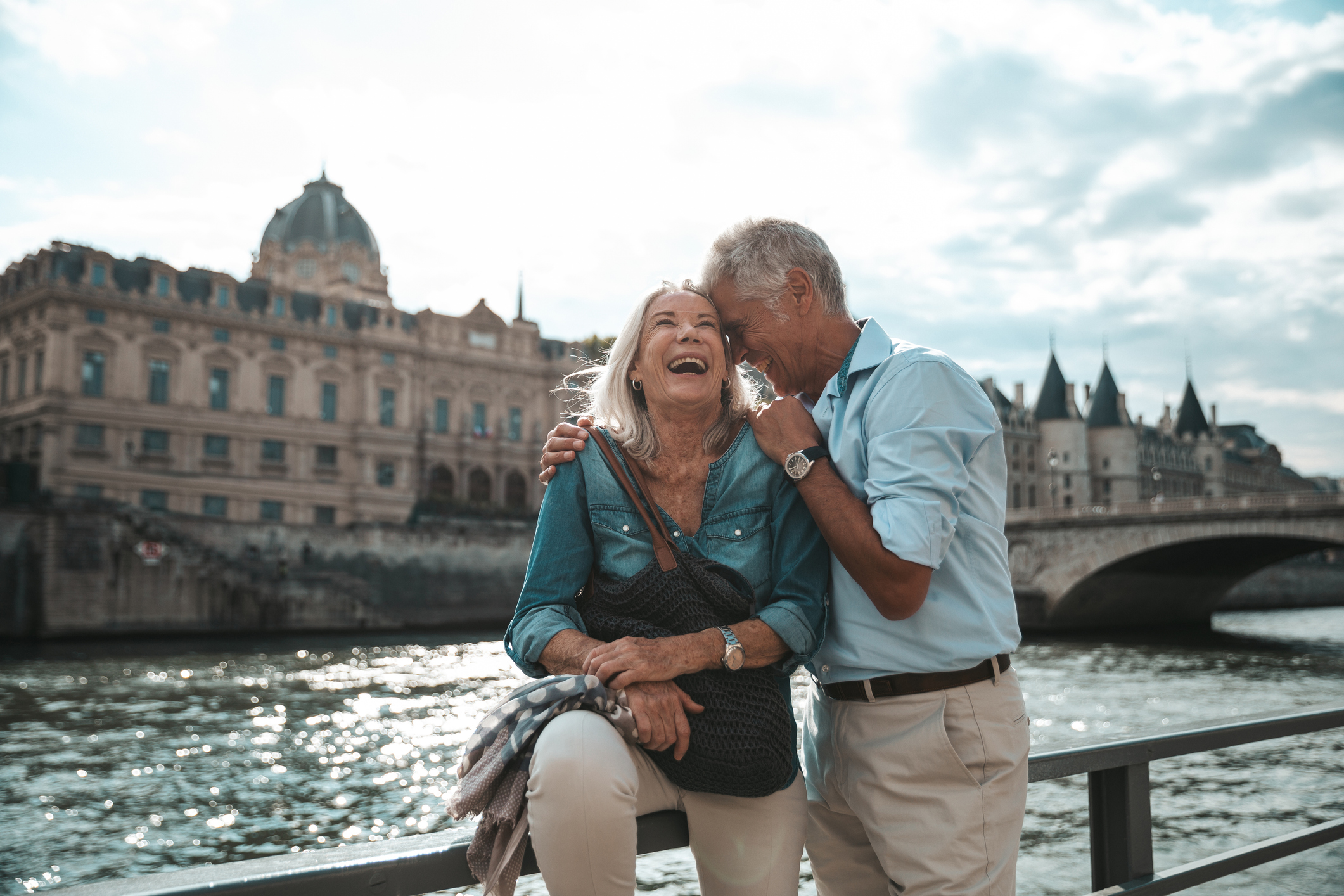 Seniors taking a break in Paris relaxing by the Seine River in Paris The Beatrice Bradley Travel Oath
